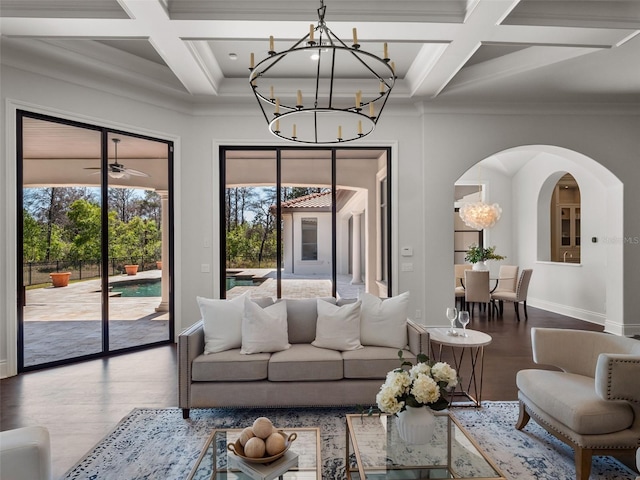 living area featuring arched walkways, wood finished floors, beamed ceiling, and coffered ceiling