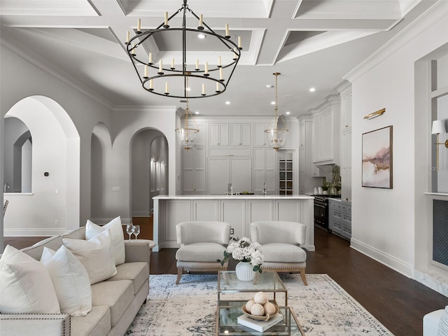living room featuring arched walkways, an inviting chandelier, coffered ceiling, baseboards, and recessed lighting