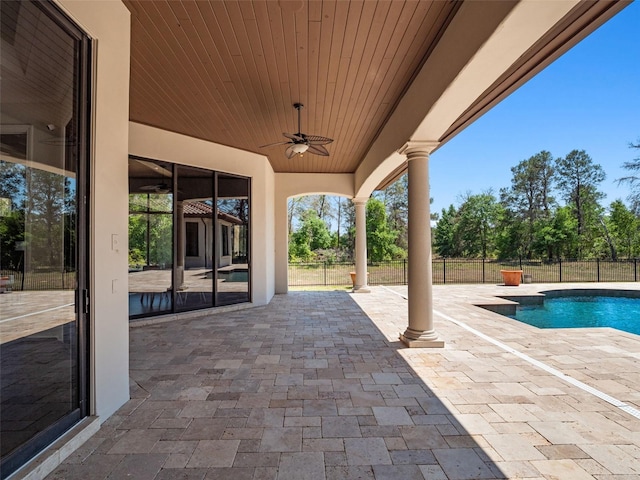 view of patio with a ceiling fan, a fenced in pool, and fence