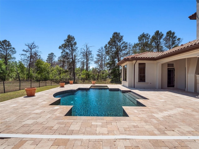 view of pool with a fenced in pool, a fenced backyard, and a patio