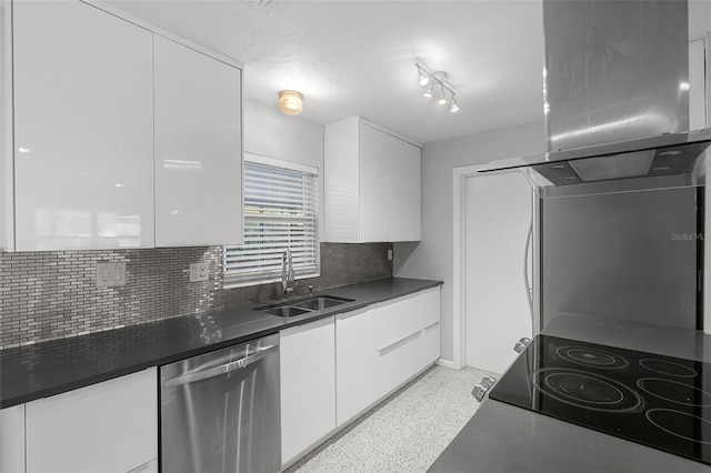 kitchen with a sink, modern cabinets, stainless steel dishwasher, and white cabinetry