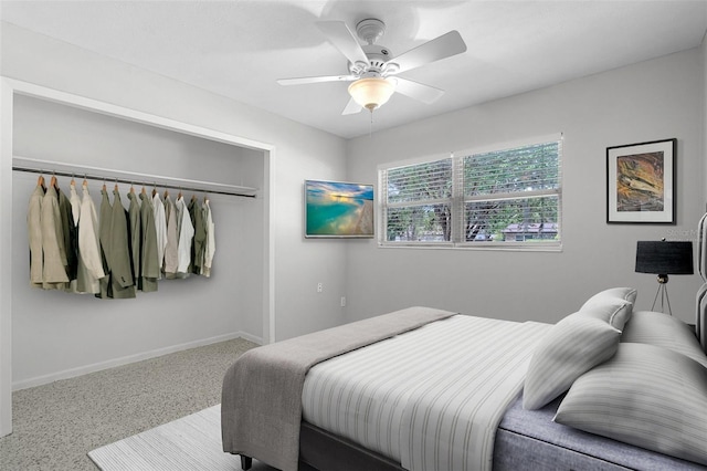 bedroom with a ceiling fan, baseboards, and a closet
