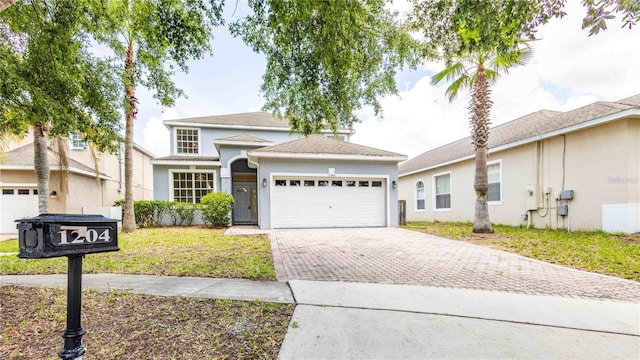 1204 Blackheath Ct, Davenport, FL 33897 - traditional home featuring driveway, a garage, stucco siding, and a front yard