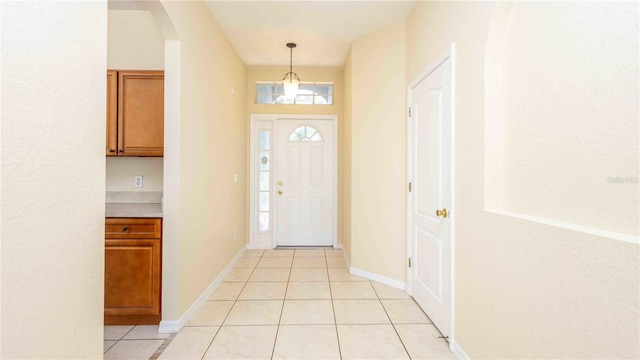 1204 Blackheath Ct, Davenport, FL 33897 - foyer entrance featuring light tile patterned floors and arched walkways