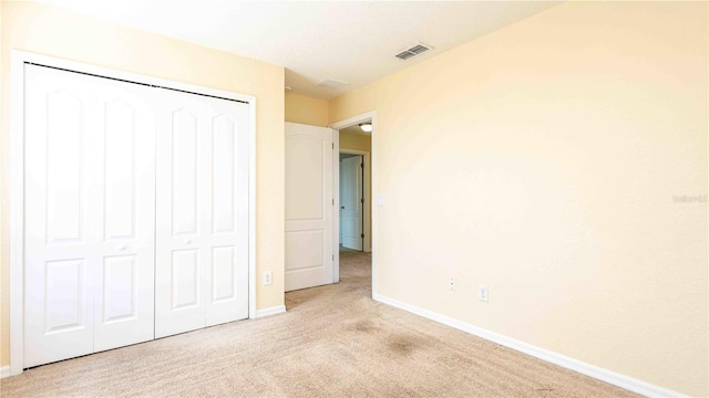 1204 Blackheath Ct, Davenport, FL 33897 - unfurnished bedroom featuring light carpet and a closet