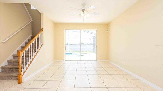 1204 Blackheath Ct, Davenport, FL 33897 - unfurnished room featuring a ceiling fan, stairway, and light tile patterned flooring