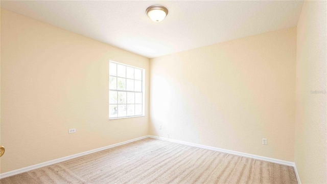 1204 Blackheath Ct, Davenport, FL 33897 - carpeted empty room with baseboards