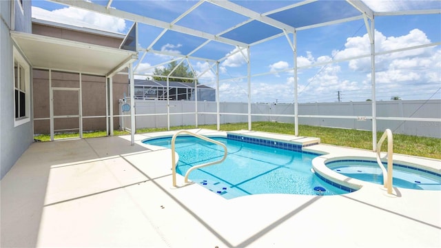 1204 Blackheath Ct, Davenport, FL 33897 - view of pool with a patio, a fenced backyard, a pool with connected hot tub, and glass enclosure