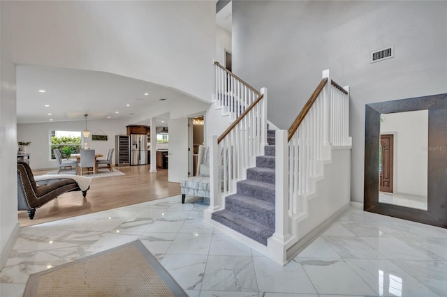 1661 Woodland Ave, Winter Park, FL 32789 - foyer entrance with a towering ceiling, marble finish floor, and visible vents