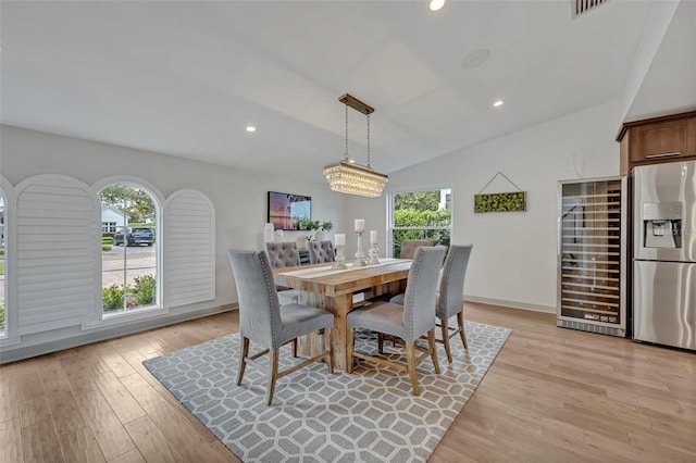 1661 Woodland Ave, Winter Park, FL 32789 - dining space with light wood-style floors, recessed lighting, beverage cooler, and lofted ceiling