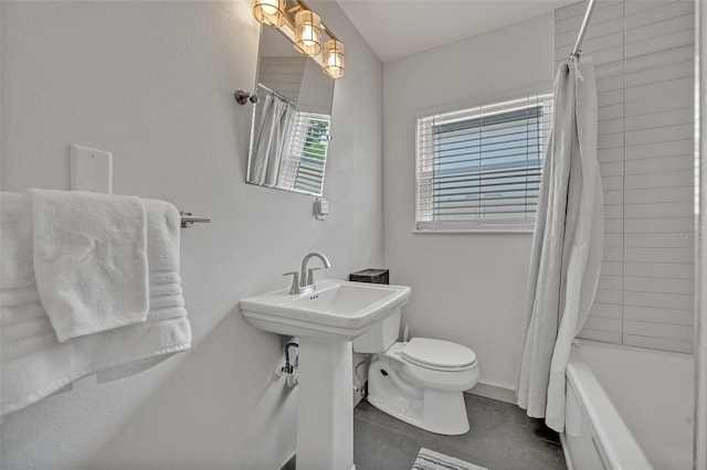 1661 Woodland Ave, Winter Park, FL 32789 - bathroom featuring tile patterned floors, toilet, and shower / bath combination with curtain
