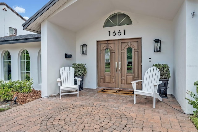 1661 Woodland Ave, Winter Park, FL 32789 - entrance to property with french doors and stucco siding