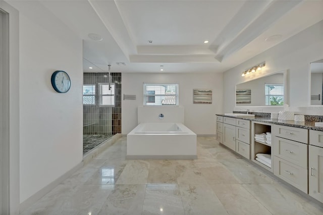 1661 Woodland Ave, Winter Park, FL 32789 - bathroom with a bath, a stall shower, vanity, a raised ceiling, and recessed lighting