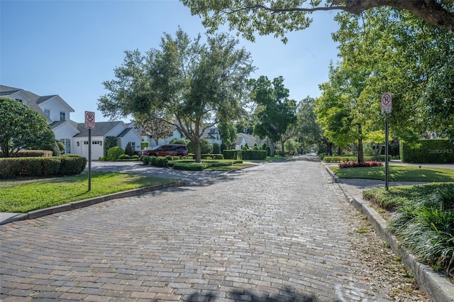 1661 Woodland Ave, Winter Park, FL 32789 - view of road with traffic signs, curbs, and a residential view