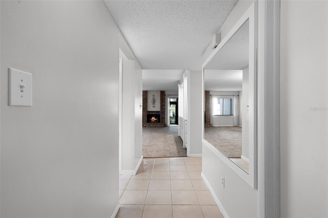 11 Escondido Cir Unit 110, Altamonte Springs, FL 32701 - hall with light colored carpet, light tile patterned floors, and a textured ceiling