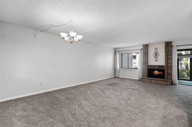 11 Escondido Cir Unit 110, Altamonte Springs, FL 32701 - unfurnished living room with a textured ceiling, a chandelier, carpet floors, and a fireplace