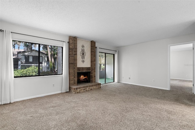 11 Escondido Cir Unit 110, Altamonte Springs, FL 32701 - unfurnished living room with a textured ceiling, carpet, and a fireplace