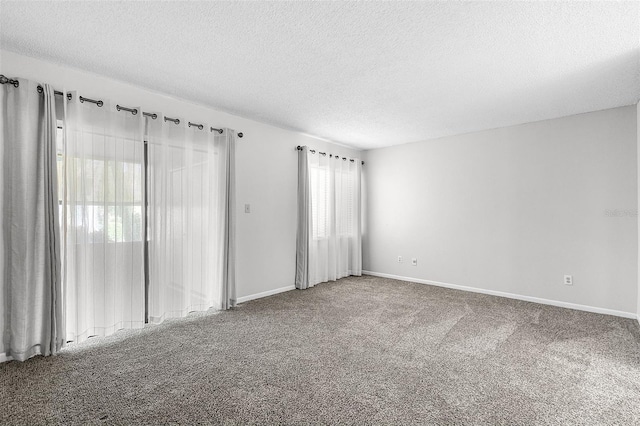 11 Escondido Cir Unit 110, Altamonte Springs, FL 32701 - carpeted empty room featuring a textured ceiling