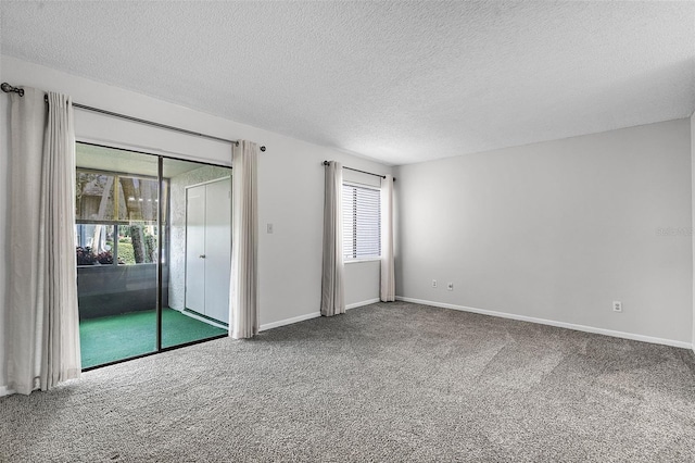 11 Escondido Cir Unit 110, Altamonte Springs, FL 32701 - unfurnished room featuring carpet and a textured ceiling