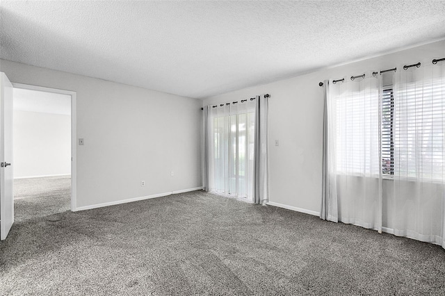 11 Escondido Cir Unit 110, Altamonte Springs, FL 32701 - carpeted spare room with a textured ceiling and baseboards