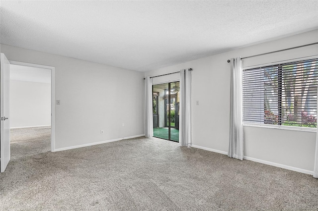 11 Escondido Cir Unit 110, Altamonte Springs, FL 32701 - empty room with a textured ceiling and carpet