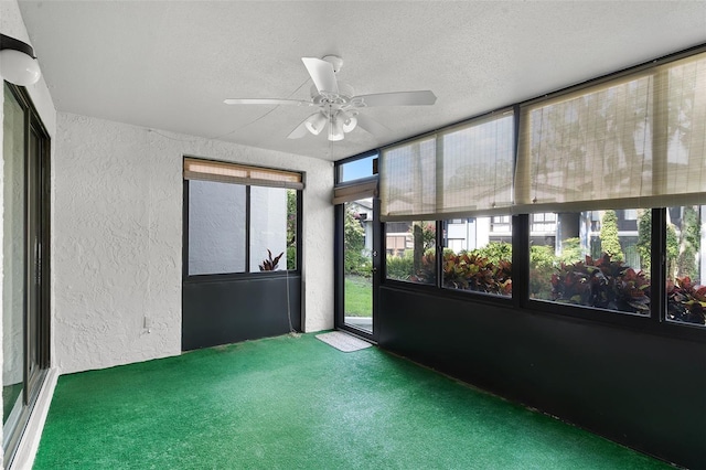 11 Escondido Cir Unit 110, Altamonte Springs, FL 32701 - unfurnished sunroom with a textured wall, carpet flooring, and a textured ceiling