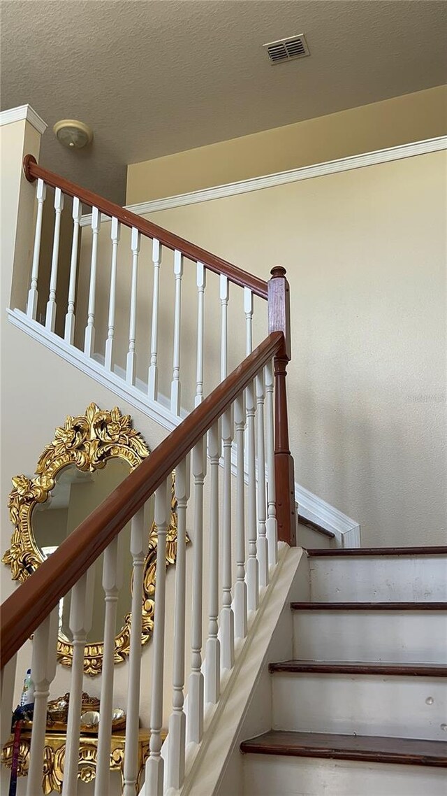 staircase with visible vents