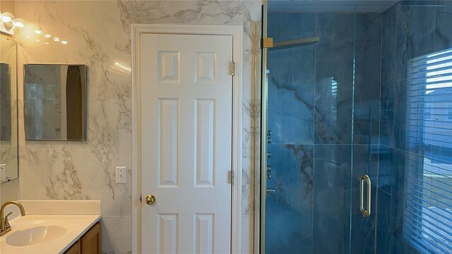 full bath featuring a shower stall and vanity