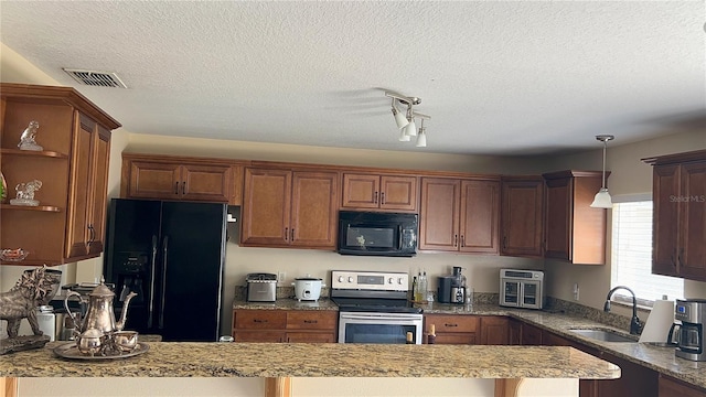 kitchen with open shelves, a sink, a textured ceiling, black appliances, and visible vents