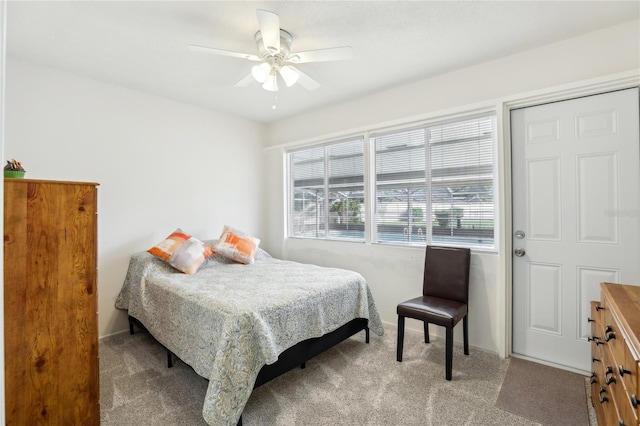bedroom featuring carpet flooring, baseboards, and a ceiling fan