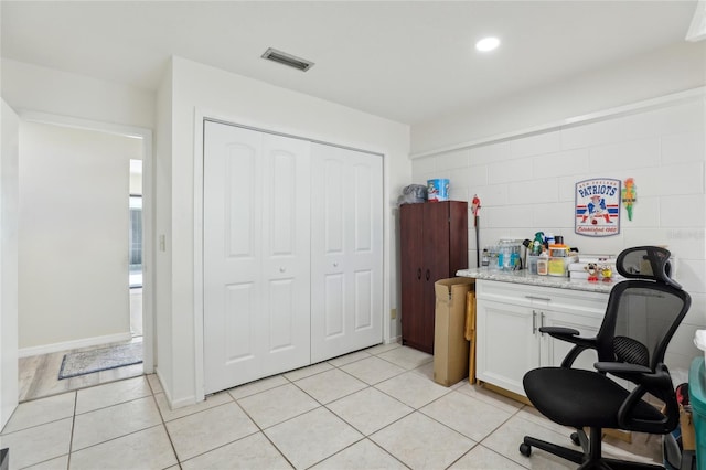 office space with visible vents, recessed lighting, and light tile patterned flooring