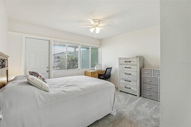 bedroom featuring light colored carpet and ceiling fan