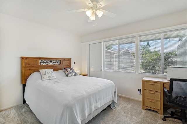 bedroom with baseboards, light colored carpet, and ceiling fan