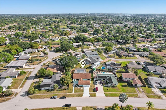 birds eye view of property with a residential view