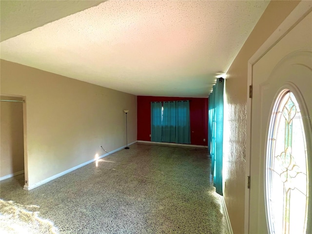1221 Oak Haven Dr, Altamonte Springs, FL 32714 - interior space featuring speckled floor, baseboards, and a textured ceiling