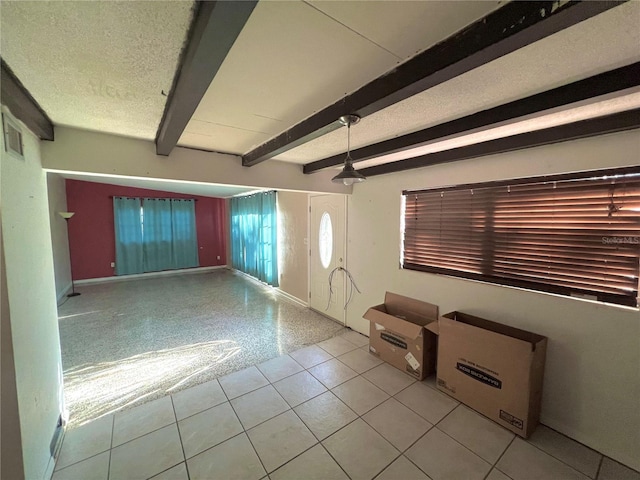 1221 Oak Haven Dr, Altamonte Springs, FL 32714 - interior space with a textured ceiling, beam ceiling, baseboards, and light tile patterned floors