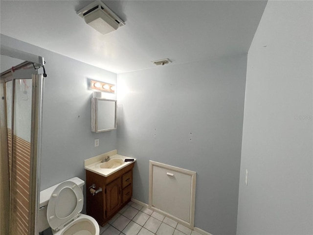 1221 Oak Haven Dr, Altamonte Springs, FL 32714 - bathroom with baseboards, vanity, tile patterned flooring, and toilet