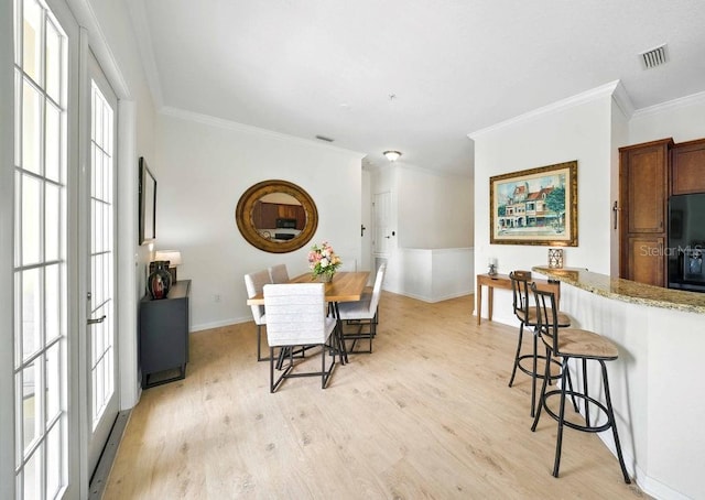 1845 Common Way Rd Unit 28-206, Orlando, FL 32814 - dining room with crown molding and light wood finished floors