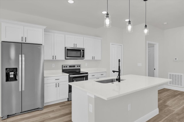 15823 SW 27th Avenue Rd, Ocala, FL 34473 - kitchen featuring visible vents, a sink, light wood-style flooring, and appliances with stainless steel finishes