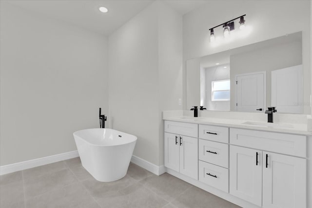 15823 SW 27th Avenue Rd, Ocala, FL 34473 - full bathroom featuring double vanity, a sink, baseboards, and a freestanding tub
