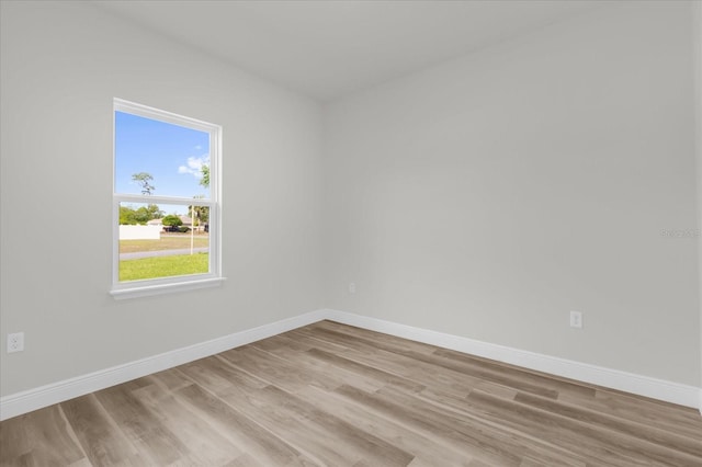 15823 SW 27th Avenue Rd, Ocala, FL 34473 - spare room featuring baseboards and light wood-style flooring