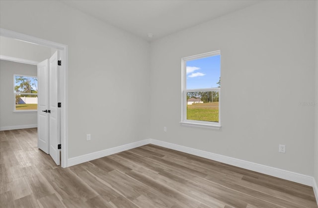 15823 SW 27th Avenue Rd, Ocala, FL 34473 - unfurnished room featuring baseboards and wood finished floors