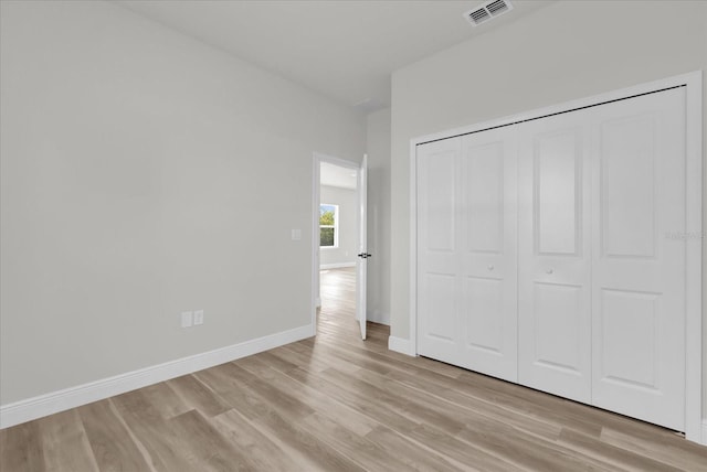 15823 SW 27th Avenue Rd, Ocala, FL 34473 - unfurnished bedroom with visible vents, light wood-style floors, baseboards, and a closet