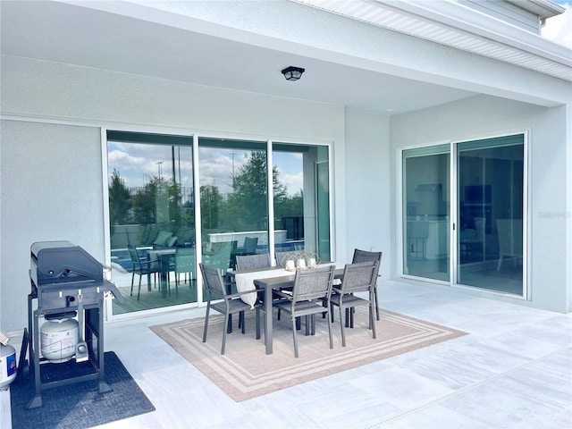 10275 Park Estates Ave, Orlando, FL 32836 - view of patio / terrace with outdoor dining space and a grill