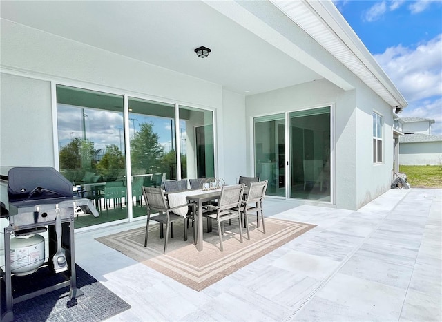 10275 Park Estates Ave, Orlando, FL 32836 - view of patio featuring grilling area and outdoor dining area