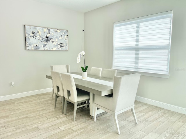 10275 Park Estates Ave, Orlando, FL 32836 - dining space featuring baseboards and wood finished floors