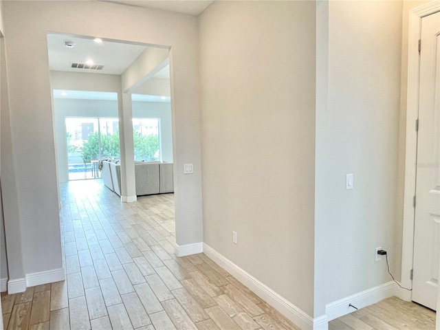 10275 Park Estates Ave, Orlando, FL 32836 - corridor featuring baseboards, visible vents, and light wood-style floors
