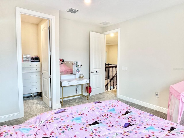 10275 Park Estates Ave, Orlando, FL 32836 - carpeted bedroom with baseboards, visible vents, and a spacious closet
