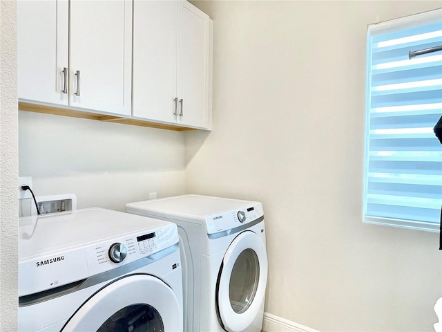 10275 Park Estates Ave, Orlando, FL 32836 - clothes washing area with cabinet space and independent washer and dryer