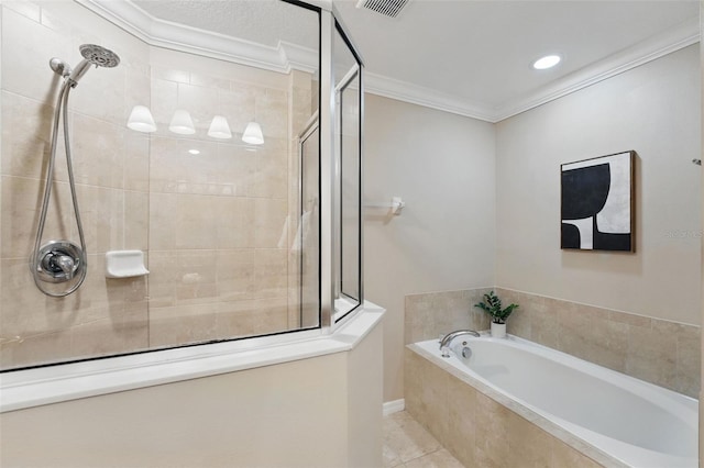 full bath with a garden tub, visible vents, tile patterned flooring, a tile shower, and ornamental molding